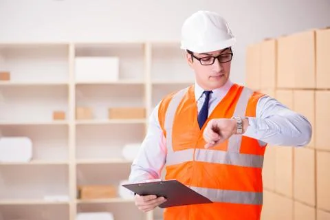 Man working in postal parcel delivery service office Stock Photos
