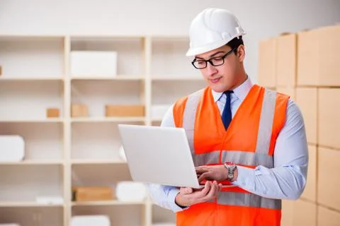 Man working in postal parcel delivery service office 스톡 사진