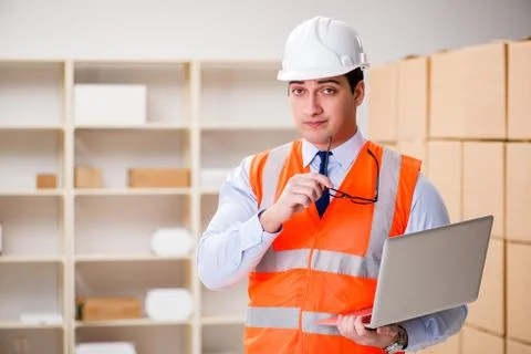 Man working in postal parcel delivery service office 스톡 사진