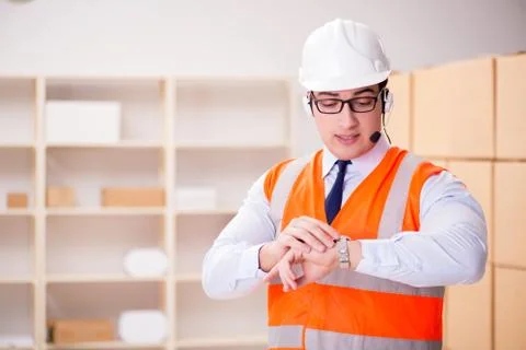 Man working in postal parcel delivery service office 스톡 사진