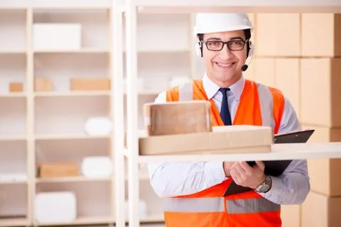 Man working in postal parcel delivery service office 写真素材