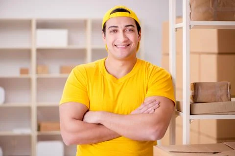 Man working in postal parcel delivery service office 스톡 사진