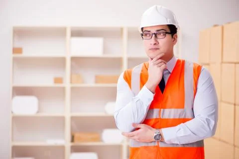 Man working in postal parcel delivery service office 스톡 사진
