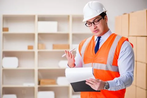 Man working in postal parcel delivery service office 스톡 사진