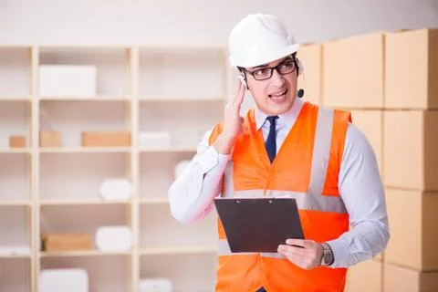 Man working in postal parcel delivery service office 스톡 사진