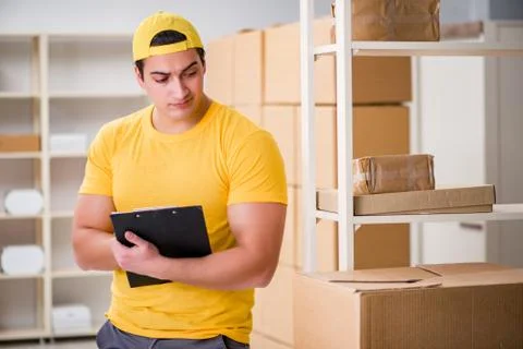 Man working in postal parcel delivery service office 写真素材