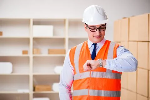 Man working in postal parcel delivery service office 스톡 사진