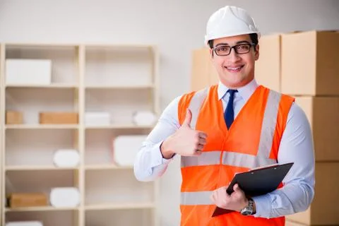 Man working in postal parcel delivery service office 스톡 사진