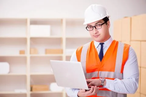 Man working in postal parcel delivery service office 写真素材
