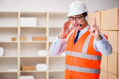 Man working in postal parcel delivery service office 스톡 사진