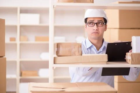 Man working in postal parcel delivery service office 스톡 사진