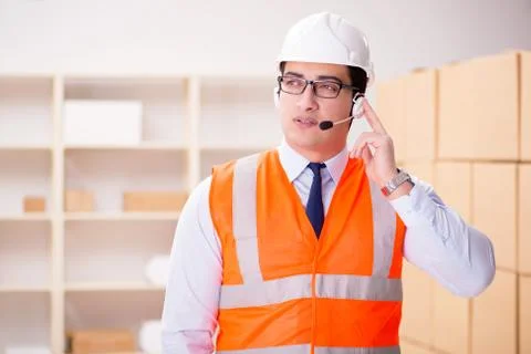 Man working in postal parcel delivery service office 스톡 사진
