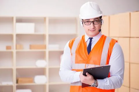 Man working in postal parcel delivery service office 스톡 사진