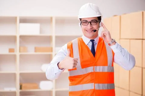 Man working in postal parcel delivery service office 스톡 사진