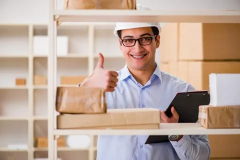 Man working in postal parcel delivery service office 스톡 사진