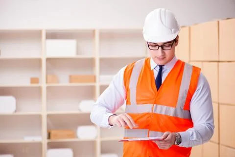 Man working in postal parcel delivery service office 스톡 사진