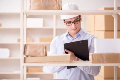 Man working in postal parcel delivery service office 스톡 사진