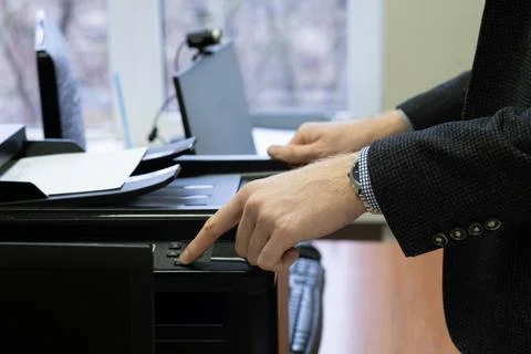 Man working on a printer Stock Photos