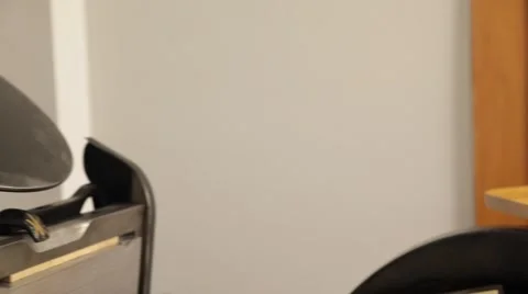 Man working on a printing press Stock Footage 66606777