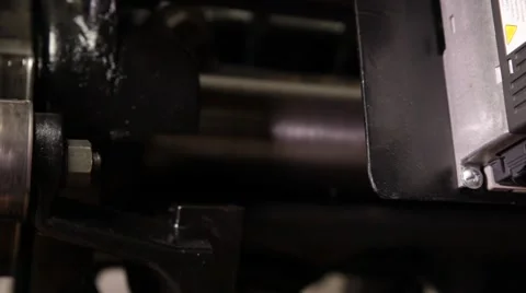 Man working on a printing press Stock Footage 66607093