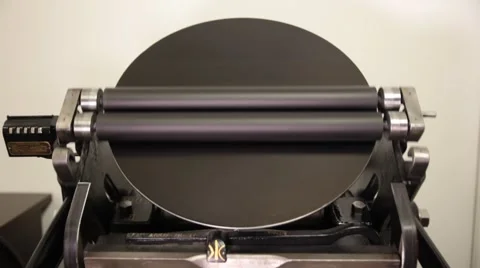 Man working on a printing press Stock Footage 66607234