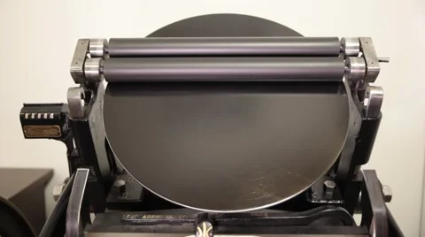 Man working on a printing press Stock Footage 66607238