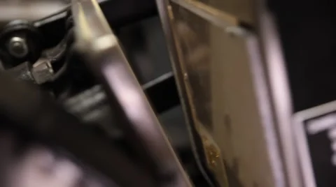 Man working on a printing press Stock Footage 66607318