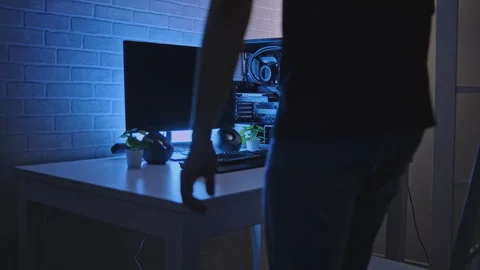 Man is working at professional computer with backlight. Clip. Man is working at Stock Footage 278382618