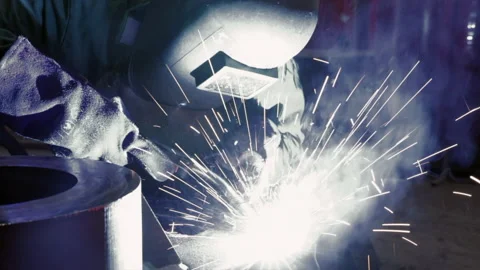 Man Working As Professional Skilled Welder In Steel Factory Stock Footage 130844043