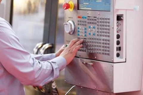 Man working at programmable machine Stock Photos