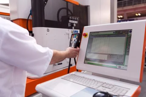Man working at programmable machine Stock Photos
