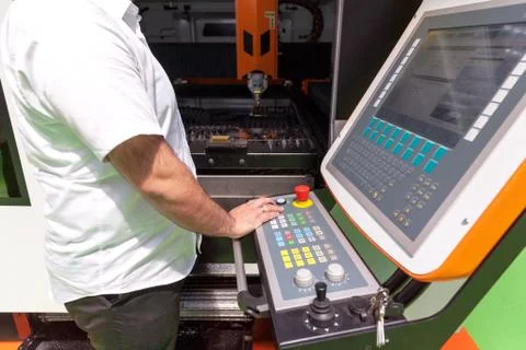 Man working at programmable machine Stock Photos