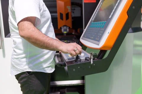 Man working at programmable machine Foto stock