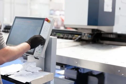 Man working at programmable machine Stock Photos