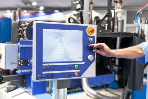 Man working at programmable machine Stock Photos