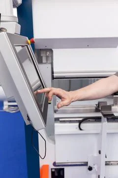 Man working at programmable machine Foto stock