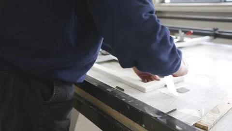 A man is working on a project at a workbench Stock Footage 302457115