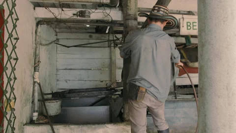 Man Working on a Pulping Machine Stock Footage 270968356