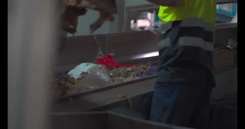 Man working on recycling belt separating garbage Stock Footage 278271997