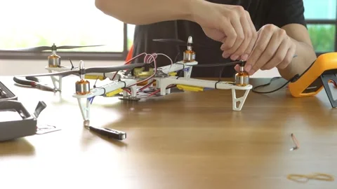 A man is working on a remote control drone Stock Footage 314899523