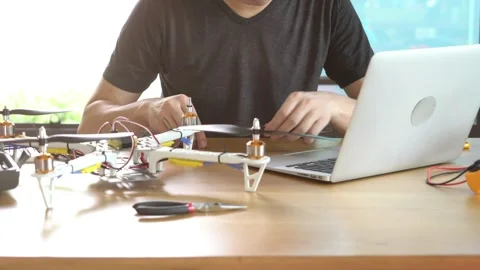 A man is working on a remote control drone Stock Footage 314899571