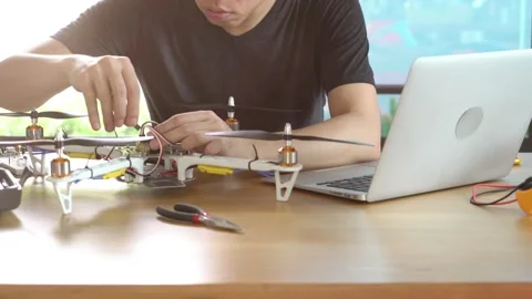A man is working on a remote control drone Stock Footage 314899593