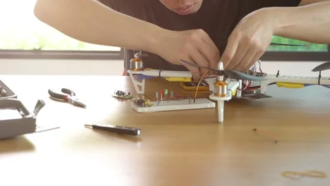 A man is working on a remote control drone Stock Footage 314899642
