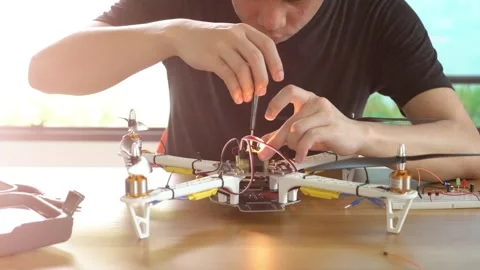 A man is working on a remote control drone Stock Footage 314899648