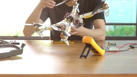 A man is working on a remote control drone Stock Footage 314899650