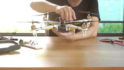 A man is working on a remote control drone Stock Footage 314899685