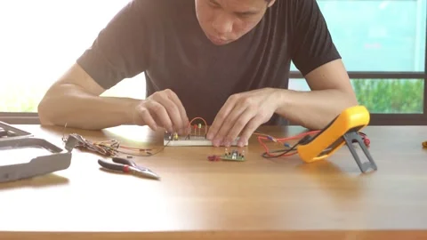 A man is working on a remote control drone Stock Footage 314899686