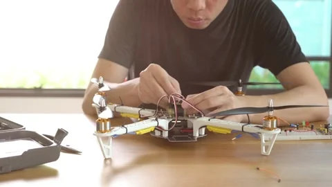 A man is working on a remote control drone Stock Footage 315116604