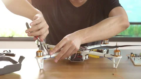 A man is working on a remote control drone Stock Footage 315116610