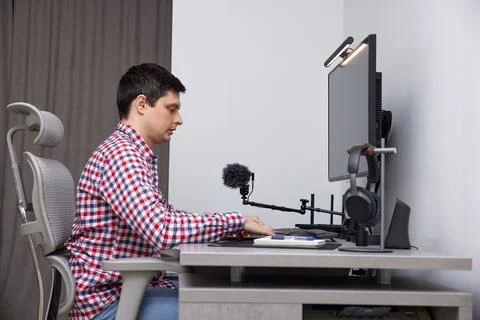 Man working remote from home creative office setup Stock Photos